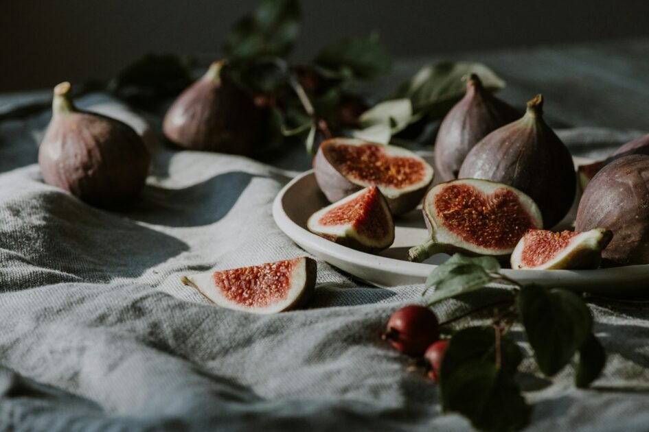 a plate of sliced figs on a table